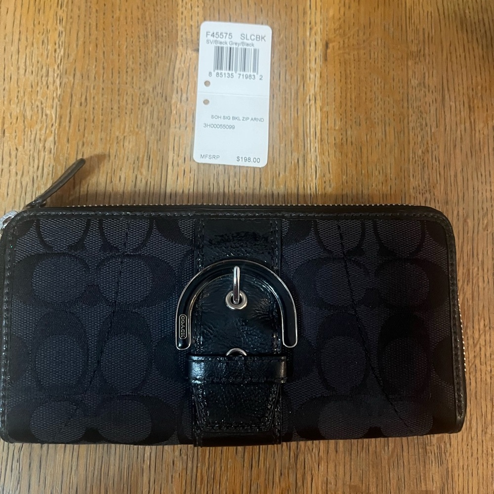 Coach Signature Black Leather Wallet. With black patent leather buckle detailing